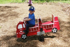 Weston is enjoying the new firetruck at the clubhouse.  Thank you, Women's Club!